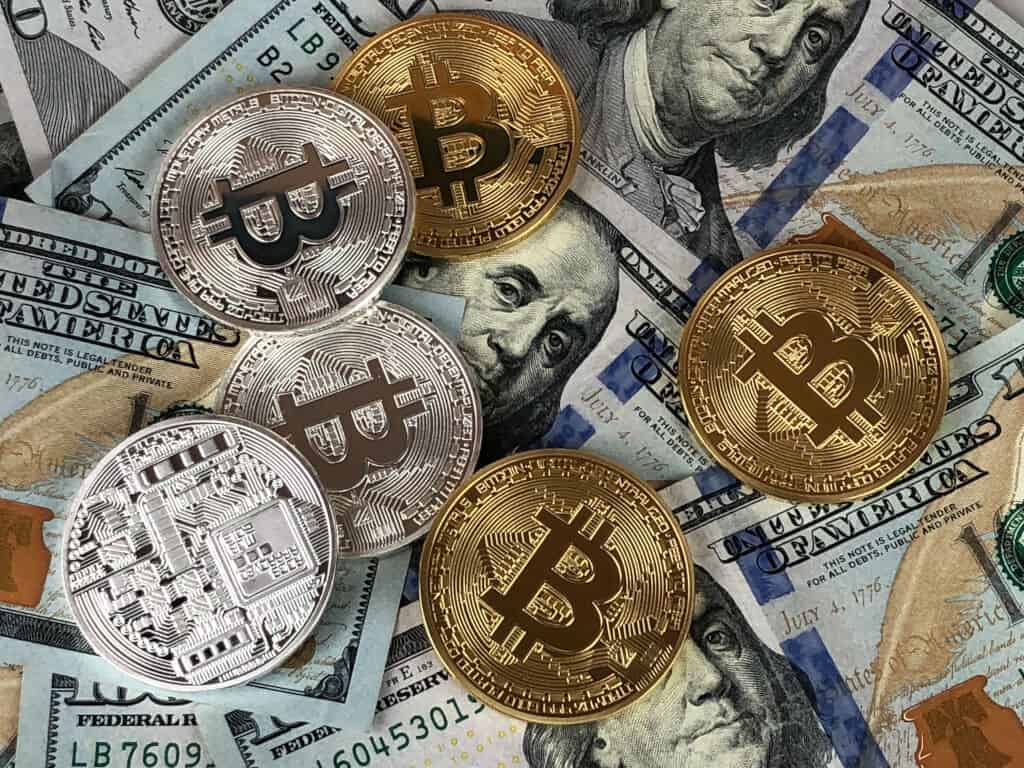 Bitcoins and dollar bills