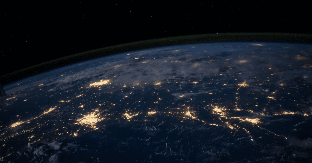 Picture of the Earth from space, at night time with the lights from cities visible